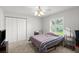 Bedroom with ceiling fan, closet and window at 5935 Shady Creek Ln, Port Orange, FL 32128