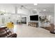 Bright open-concept living room with tile flooring, ceiling fan, and view of other rooms at 5935 Shady Creek Ln, Port Orange, FL 32128
