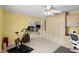 View of the office with built-in shelving, an exercise bike, and view to other rooms at 5935 Shady Creek Ln, Port Orange, FL 32128