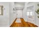 Inviting foyer with gleaming hardwood floors, white walls, and access to the living areas at 620 Middlebury Loop, New Smyrna Beach, FL 32168