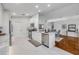 Modern kitchen with white cabinets, stainless steel appliances, and marble countertops at 620 Middlebury Loop, New Smyrna Beach, FL 32168