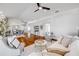 Open concept living room and dining area with hardwood flooring and lots of natural light at 620 Middlebury Loop, New Smyrna Beach, FL 32168