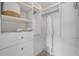 Bright walk-in closet with custom shelving, drawers, and ample storage space at 620 Middlebury Loop, New Smyrna Beach, FL 32168