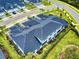 Drone image revealing a scenic view of the house next to other houses and a verdant forest in the background at 6307 Hanfield Dr, Port Orange, FL 32128