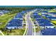 An aerial view showcases a community with well-maintained streets and similar homes, close to a wooded area at 6307 Hanfield Dr, Port Orange, FL 32128