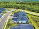 Aerial of new construction community with a beautiful home in a neighborhood with a winding road at 6307 Hanfield Dr, Port Orange, FL 32128
