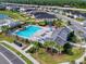 Aerial image showcasing the sparkling community pool, clubhouse, playground, and scenic neighborhood layout at 6307 Hanfield Dr, Port Orange, FL 32128