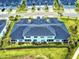 Aerial view of backyard featuring screened patio, beautiful lawn, and mature landscaping at 6307 Hanfield Dr, Port Orange, FL 32128