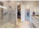 This bathroom features a walk-in shower and an open doorway to the walk-in closet at 6307 Hanfield Dr, Port Orange, FL 32128