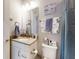 Charming bathroom with vanity, tub-shower combo, and nautical-themed decor, creating a relaxing and inviting space at 6307 Hanfield Dr, Port Orange, FL 32128