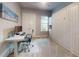 Bedroom with Murphy bed, desk, neutral color palette, and great natural light, a perfect space for relaxation or productivity at 6307 Hanfield Dr, Port Orange, FL 32128