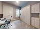 Bedroom with Murphy bed, desk, neutral color palette, and great natural light, a perfect space for relaxation or productivity at 6307 Hanfield Dr, Port Orange, FL 32128