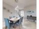 Stylish dining area featuring a modern chandelier and views of the entryway at 6307 Hanfield Dr, Port Orange, FL 32128