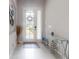 Bright entryway with a glass front door, stylish console table, and modern decor at 6307 Hanfield Dr, Port Orange, FL 32128