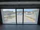 Interior view through retractable garage screen to the home's beautiful exterior and neighborhood at 6307 Hanfield Dr, Port Orange, FL 32128