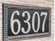 Decorative house number '6307' displayed in a modern frame, offering a clear address marker at 6307 Hanfield Dr, Port Orange, FL 32128