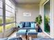 Cozy lanai featuring comfortable seating, stylish decor, and a serene view, perfect for relaxation at 6307 Hanfield Dr, Port Orange, FL 32128