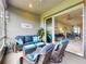 Inviting lanai with modern seating and access to the open-concept living and dining areas at 6307 Hanfield Dr, Port Orange, FL 32128