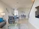 Bright, open living area featuring stylish furniture, modern lighting, and staircase at 6307 Hanfield Dr, Port Orange, FL 32128