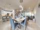 Open-concept living space with a dining area, modern lighting, and a view into the kitchen at 6307 Hanfield Dr, Port Orange, FL 32128
