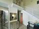 Entryway featuring a modern staircase and tiled floors at 6340 Engram Rd, New Smyrna Beach, FL 32169