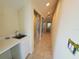 Hallway with sink, closet, and tiled floors at 6340 Engram Rd, New Smyrna Beach, FL 32169