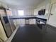 The kitchen features white cabinets and modern appliances at 6340 Engram Rd, New Smyrna Beach, FL 32169