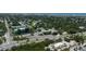 Aerial view of neighborhood with mature trees and proximity to the beach at 653 Goodwin Ave, New Smyrna Beach, FL 32169
