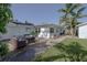 Spacious backyard with a patio and comfortable wicker seating, perfect for outdoor entertaining at 653 Goodwin Ave, New Smyrna Beach, FL 32169
