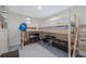 Shared bedroom with a wooden bunk bed and plenty of room for activities at 653 Goodwin Ave, New Smyrna Beach, FL 32169