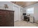 Functional office space includes a desk, chair, cabinet, and natural wood ceiling at 653 Goodwin Ave, New Smyrna Beach, FL 32169