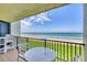 Relax on this condo balcony with seating and ocean views at 6727 Turtlemound Rd # 318, New Smyrna Beach, FL 32169