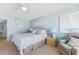 Comfortable bedroom featuring a queen-sized bed, soft lighting, and calming decor for a relaxing atmosphere at 6727 Turtlemound Rd # 318, New Smyrna Beach, FL 32169