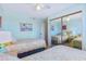 Inviting bedroom with twin beds, ample storage, and cheerful decor, creating a cozy and functional space at 6727 Turtlemound Rd # 318, New Smyrna Beach, FL 32169
