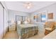 Cozy bedroom featuring a comfortable bed, ample natural light, and stylish decor, creating a relaxing and inviting space at 6727 Turtlemound Rd # 318, New Smyrna Beach, FL 32169