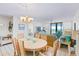 Cozy dining room with seating for six with ocean views from the nearby living room at 6727 Turtlemound Rd # 318, New Smyrna Beach, FL 32169
