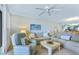 Bright living room with a view of the kitchen and dining areas at 6727 Turtlemound Rd # 318, New Smyrna Beach, FL 32169