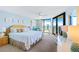 Serene main bedroom boasting ocean views through sliding glass doors, and decor that creates a relaxing retreat at 6727 Turtlemound Rd # 318, New Smyrna Beach, FL 32169