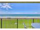 Balcony view showcasing the oceanfront location with pristine beach and inviting outdoor seating, perfect for relaxation and enjoying scenic vistas at 6727 Turtlemound Rd # 318, New Smyrna Beach, FL 32169
