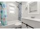 Updated bathroom featuring marble tile walls, modern fixtures, a shower-tub combination, and a new vanity at 680 Buford Ave, Orange City, FL 32763