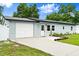 Single-story home with a one-car garage, concrete driveway and sidewalk leading to a white front door at 680 Buford Ave, Orange City, FL 32763