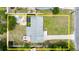 Overhead view of the property showcasing the layout, fenced yard, and outdoor living spaces at 680 Buford Ave, Orange City, FL 32763