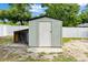 Exterior view of a backyard shed, great for storage, with a white door and siding at 680 Buford Ave, Orange City, FL 32763