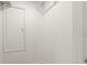 Walk-in closet featuring minimalist white interior with a storage shelf and a simple design for organized storage at 680 Buford Ave, Orange City, FL 32763