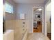 Bathroom with a tub and a shower and a view into the bedroom beyond at 686 Middlebury Loop, New Smyrna Beach, FL 32168