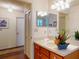 Bright bathroom with vanity and ample counter space, enhanced by modern lighting and a clean, fresh aesthetic at 686 Middlebury Loop, New Smyrna Beach, FL 32168