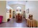 Formal dining room featuring a decorative chandelier, arched window, and hardwood floors at 686 Middlebury Loop, New Smyrna Beach, FL 32168
