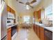 Cozy eat-in kitchen with stainless steel appliances and hardwood cabinets at 686 Middlebury Loop, New Smyrna Beach, FL 32168