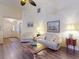 Bright living room with hardwood floors, comfortable seating, and elegant decor at 686 Middlebury Loop, New Smyrna Beach, FL 32168
