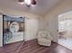 Inviting living room with sunroom access and seating, bright lighting, and stylish decor at 686 Middlebury Loop, New Smyrna Beach, FL 32168